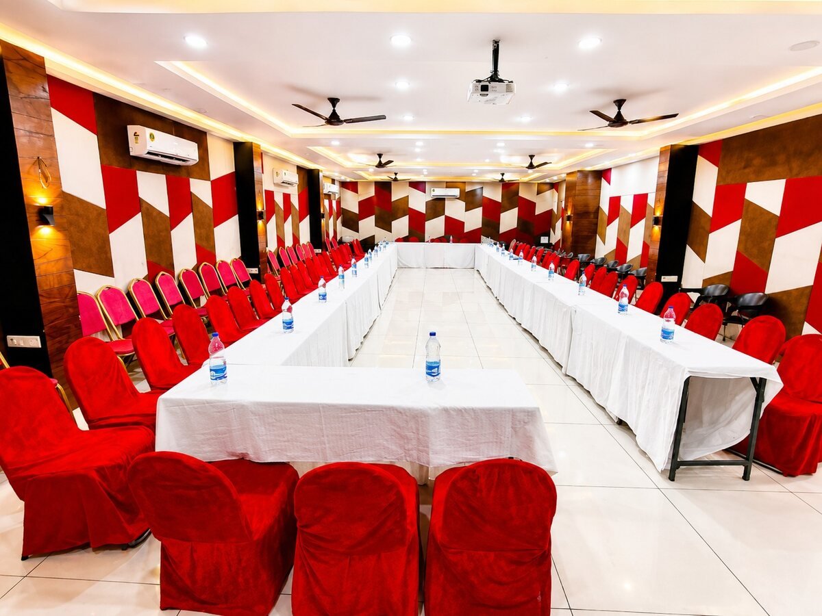 A conference set up with long tables and seating