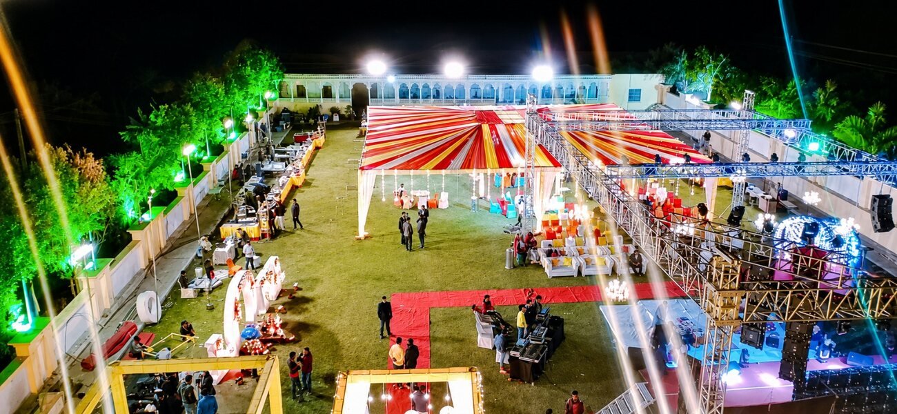 An evening function on the resort lawn lit up at night